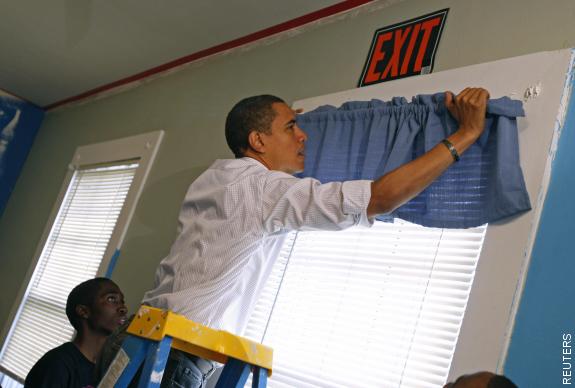 Obama putting up curtains. He is athletic, but has he ever used real tools ever in his life? Could he look at an electrical circuit box and know what was in there besides turning one switch from Off to On? I doubt it...He has servants for that...