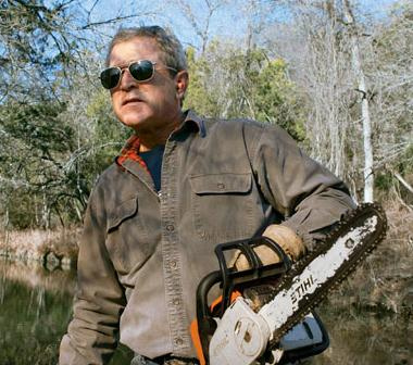George W Bush with a chainsaw. He actually knows how to use a chainsaw. I'll bet he even knows how to change the oil in his pickup.