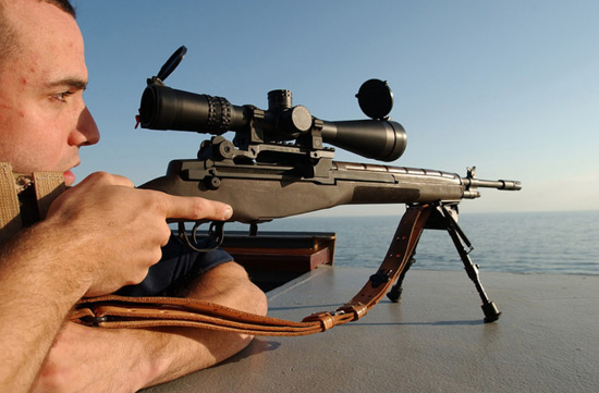 U.S. Navy SEAL Sniper with his Springfield M1A rifle on the deck of a ship